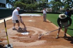 This is Bruce Bates and Kevin Hardy of Ballpark Maintenance Company finishing off the batters box at the City of Palms Park.